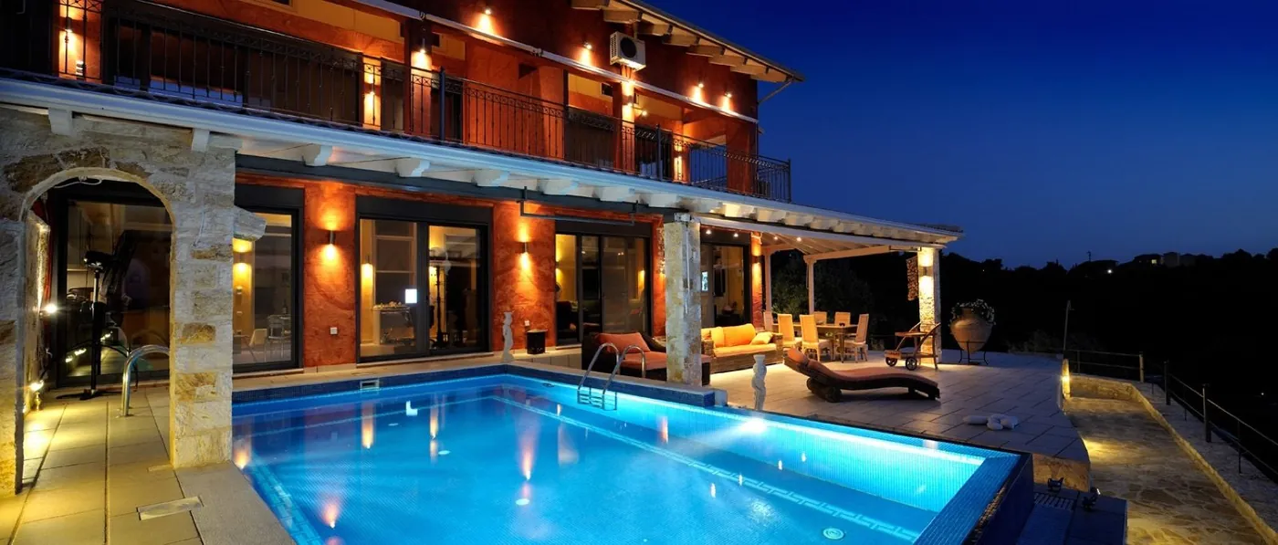 Sivota villa private pool lit at night