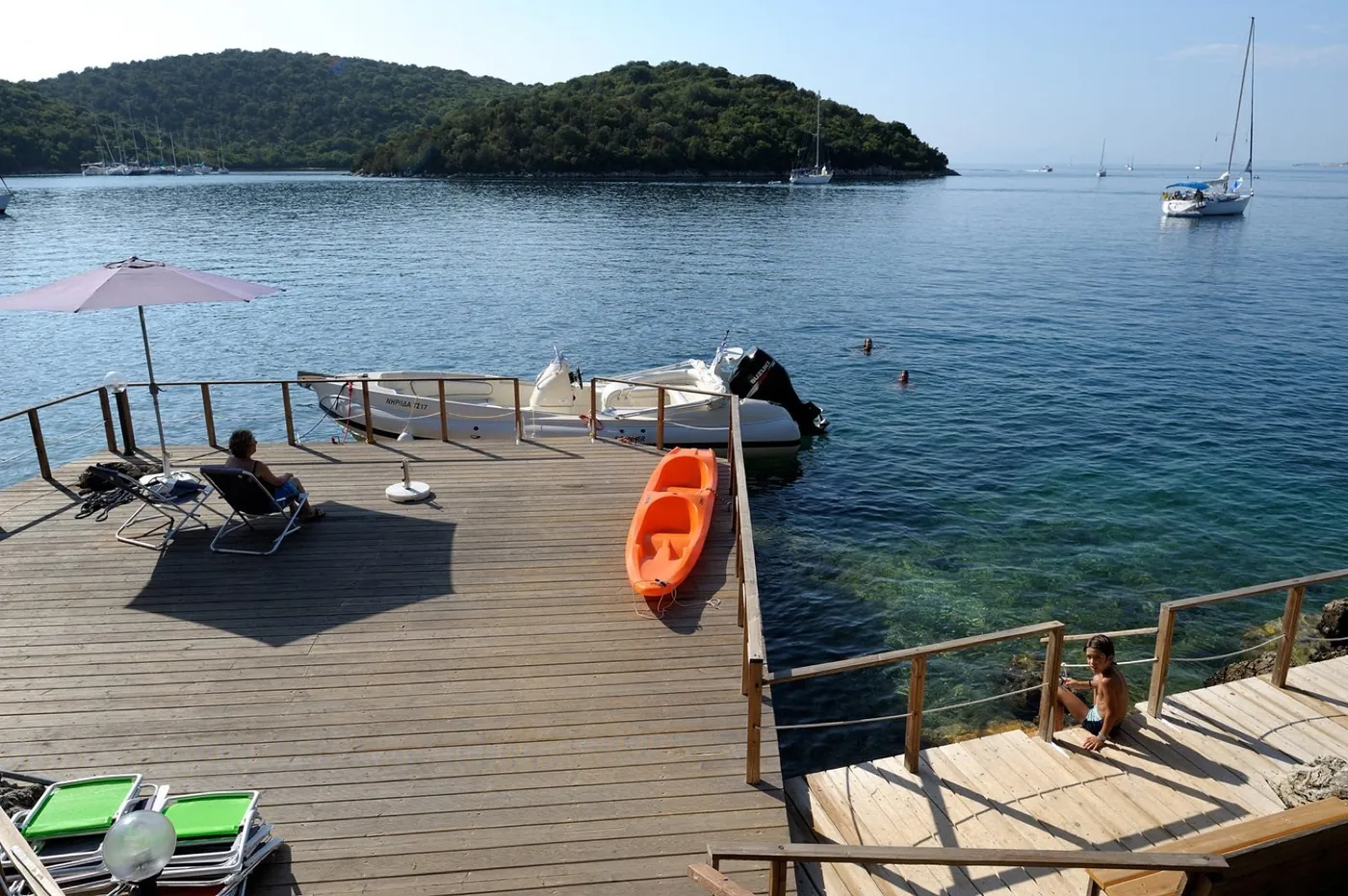 Private dock with boats and kayaks, Sivota