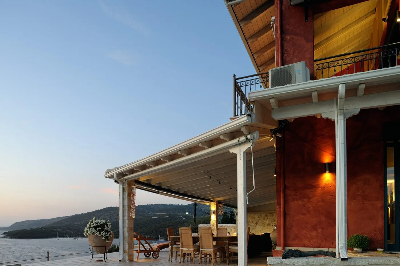 Pergola dining at sunset over the Ionian Sea